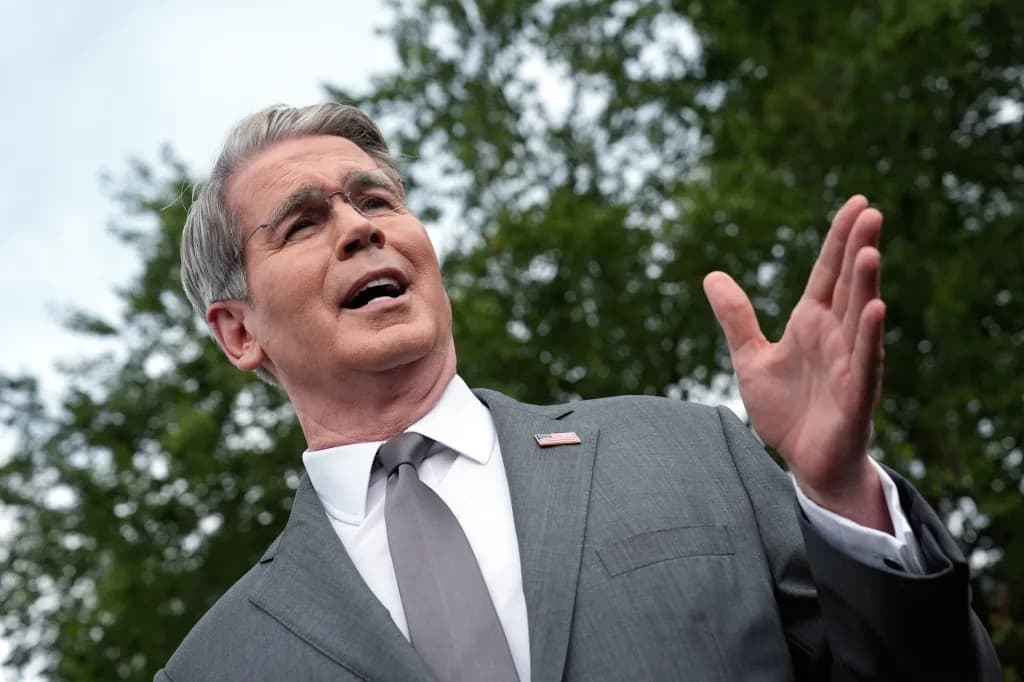 Treasury Secretary Scott Bessent speaking outdoors, gesturing while addressing reporters